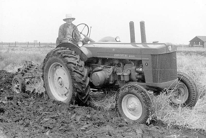 Lester drving a John Deere R in the 1950s